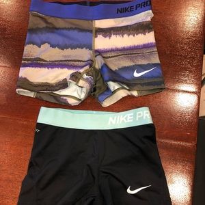 2 pairs of Nike pros